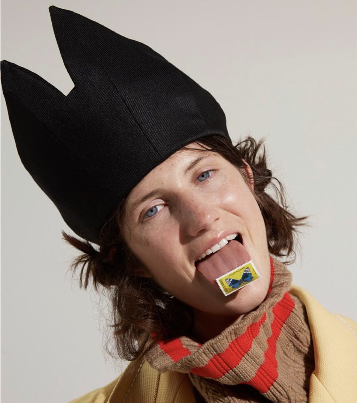 Studio fashion portrait, black headpiece and knitwear